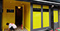 Yellow vinyl applied to windows of nightclub with black chevrons.