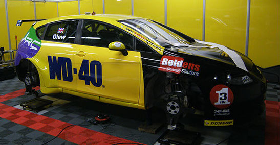 Partly wraped yellow Renault Clio race car for WD40.