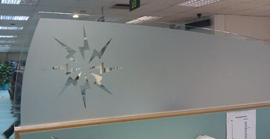 Cut frosted vinyl applied to 10mm toughened glass desk dividers
