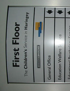 User adaptable information sign with paper inserts.