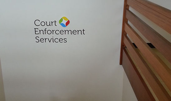 Vinyl text & located symbol applied to stairwell to guide clients up to offices